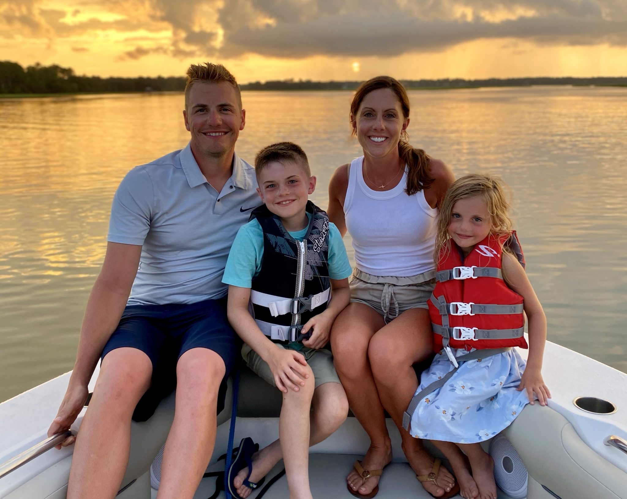 family enjoying sunset cruise by savage island