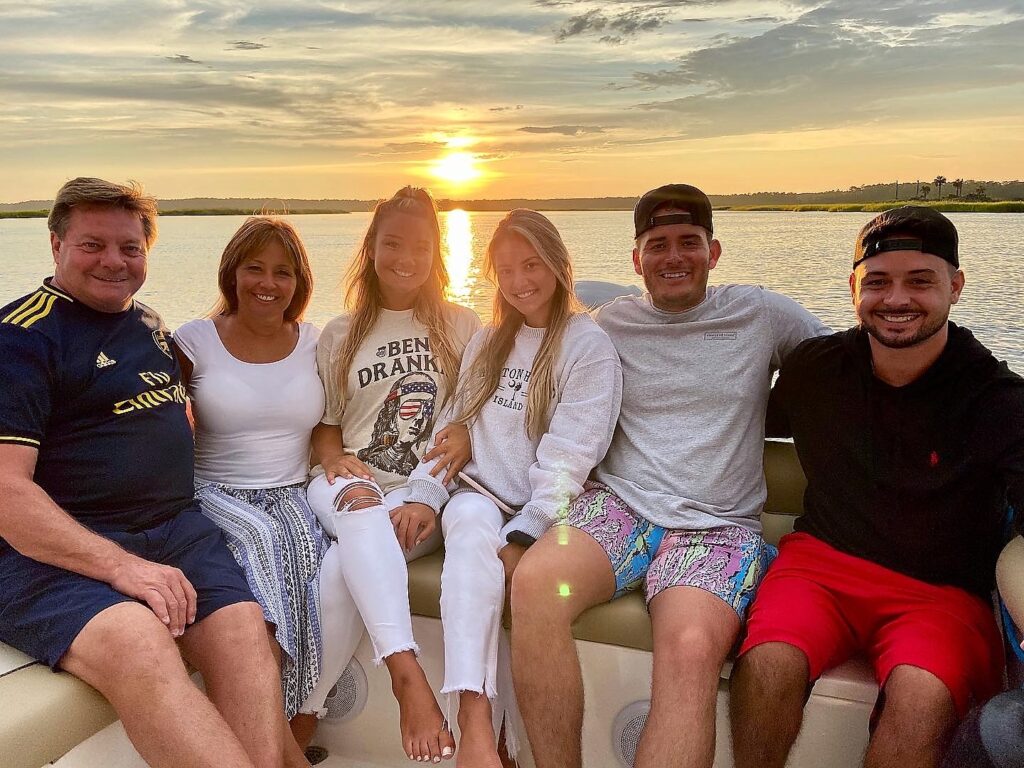 Family reveling in spectacular sunset