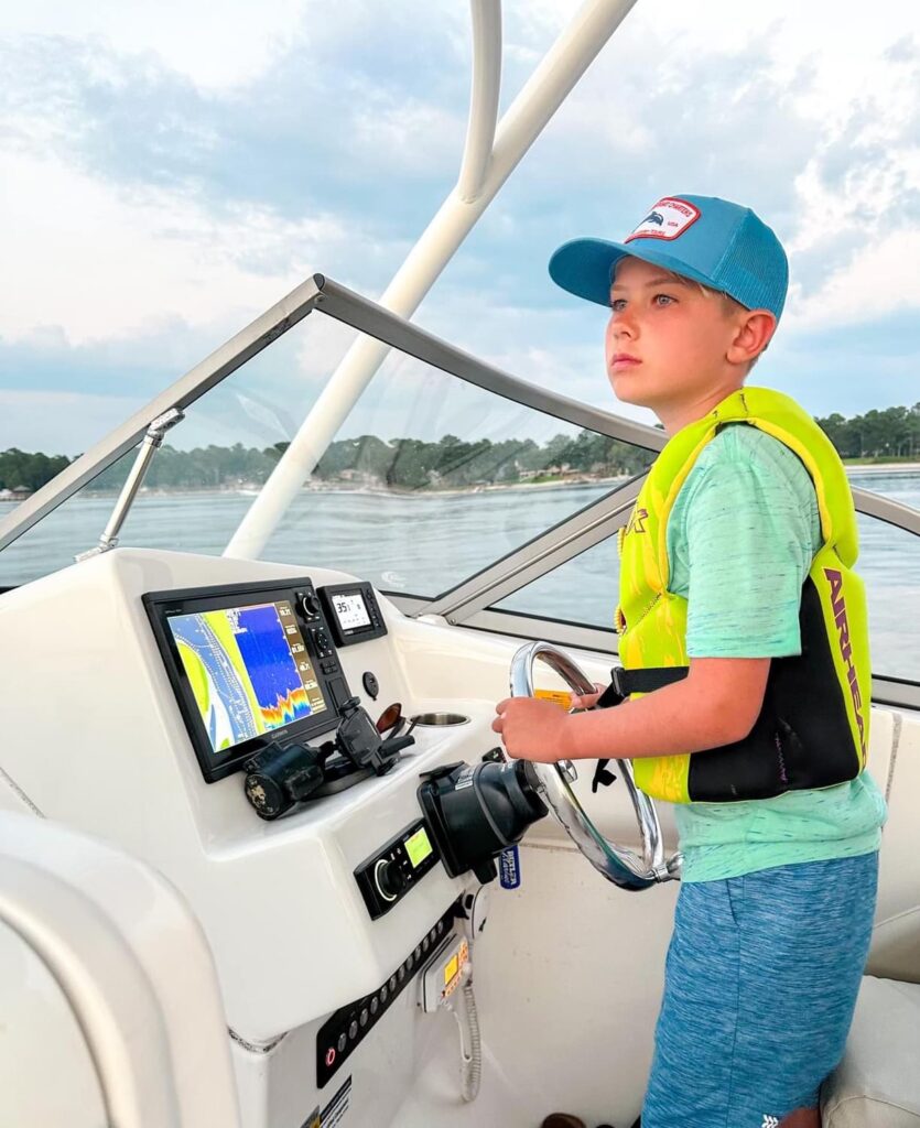 Junior captain at the helm of 24 foot key west